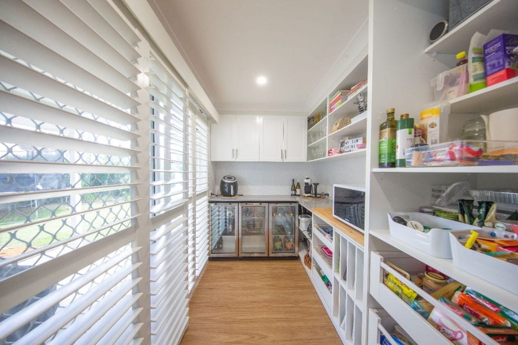 Small kitchen with wall space used as cabinets