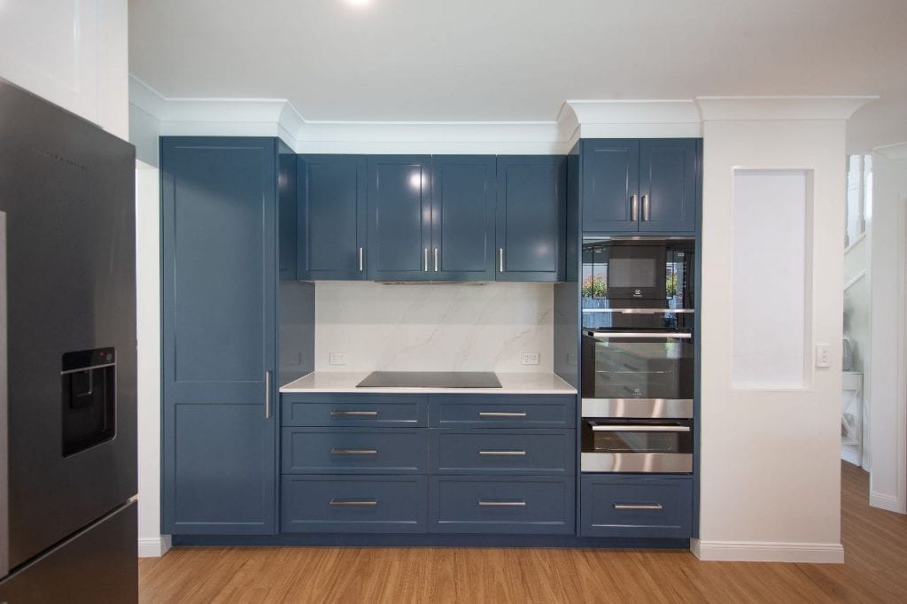 custom blue cabinets in a small kitchen