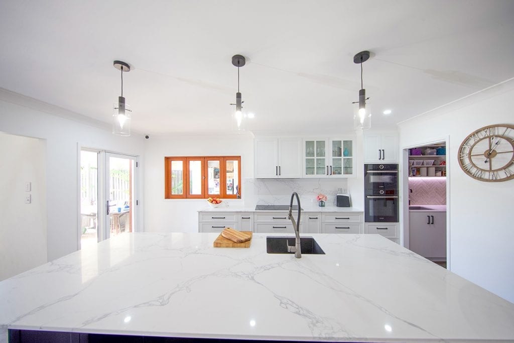 Top down view of marble bench top island bench with single sink basin