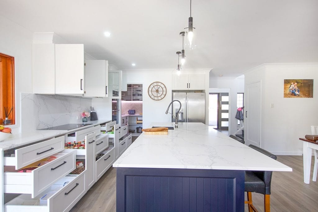 White marble kitchen with abundant kitchen storage