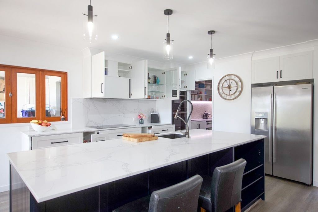 Black Leather Barstools under blue island bench