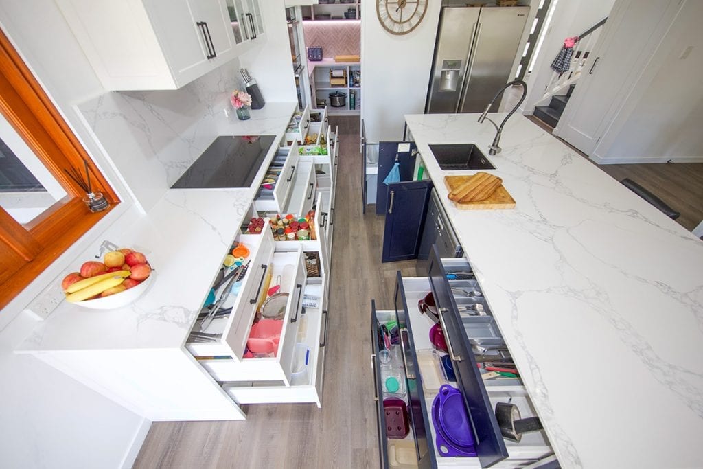 Top down view of kitchen storage drawers and cupboards