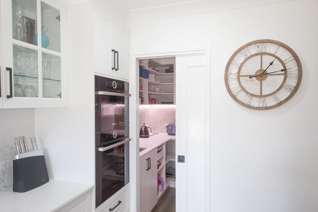 View into walk in kitchen pantry