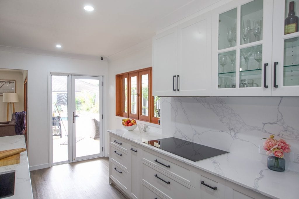 White Marble Bench top white marble splashback with black stove hotplate