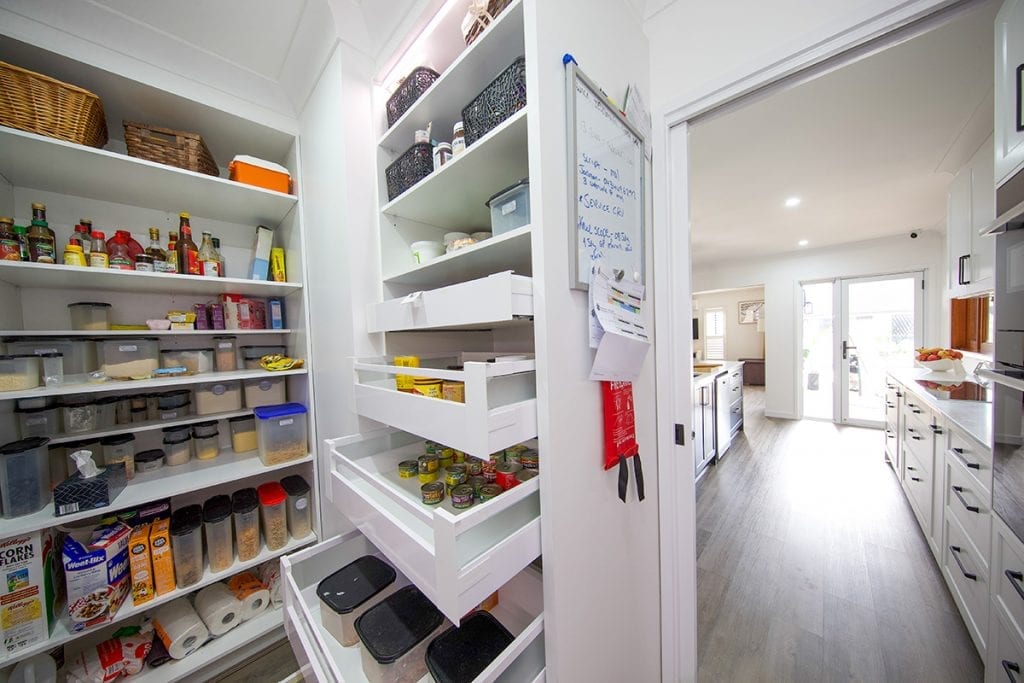 Close up of sliding storage drawers in walk in pantry