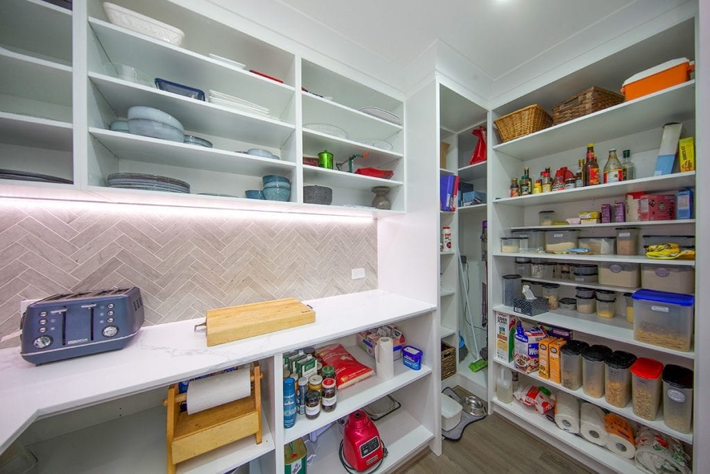 Large cupboard for storage containers inside walk in pantry