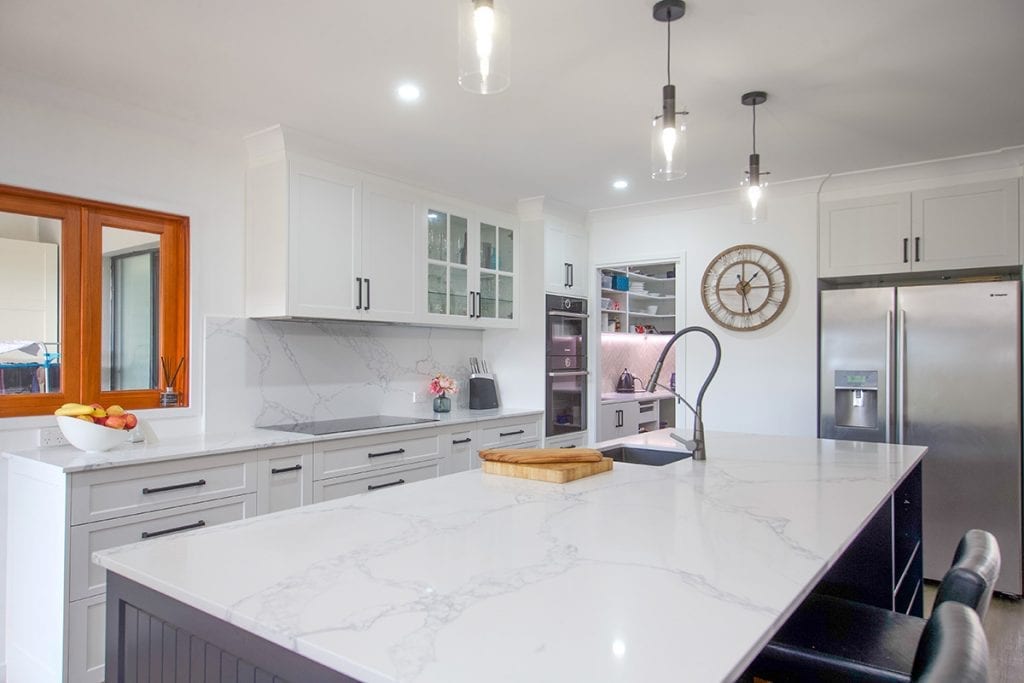 View over white marble top kitchen island bench
