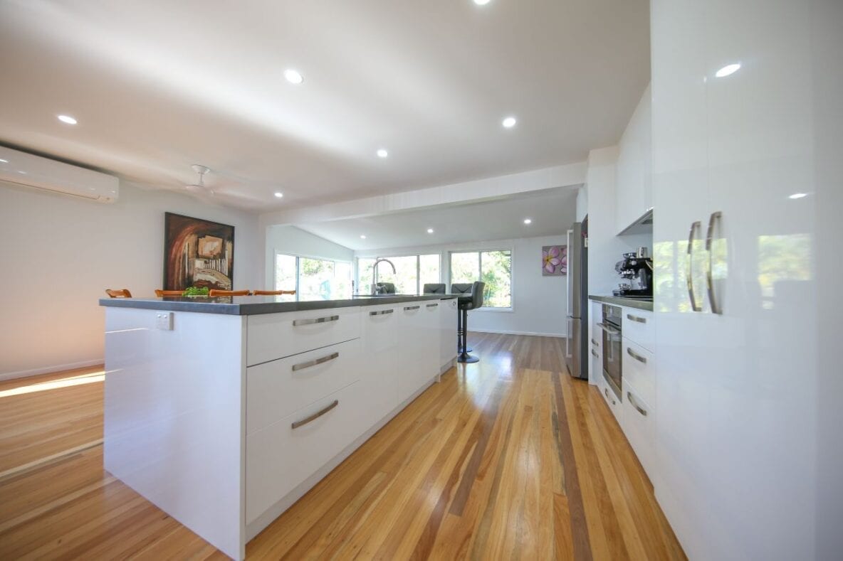 Kitchen cabinets by wooden floor