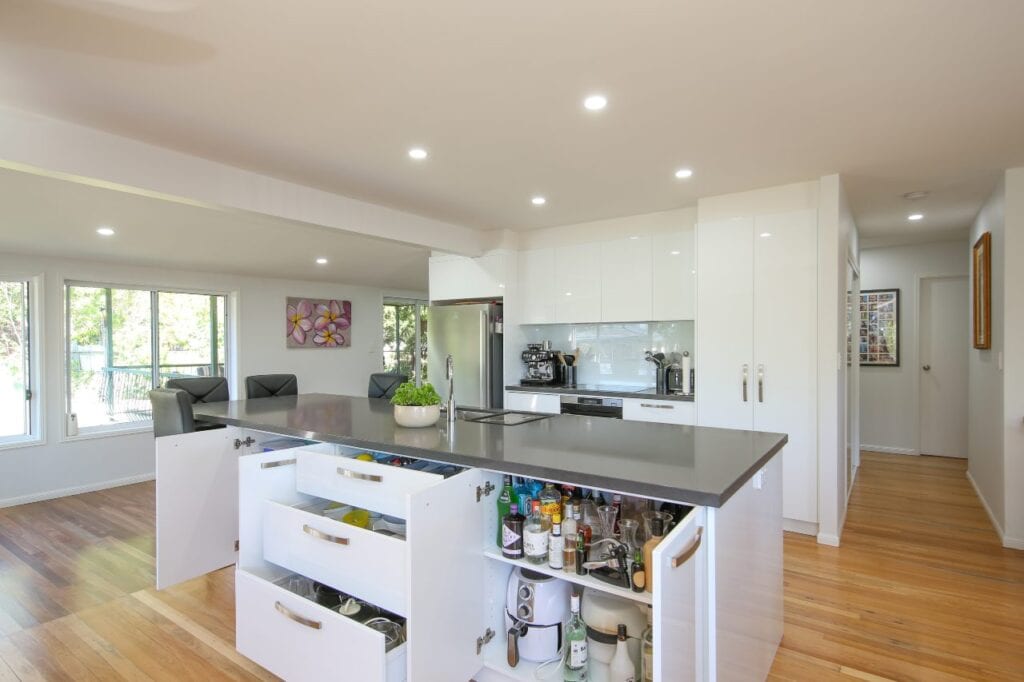 Island Bench with open cupboards and drawers