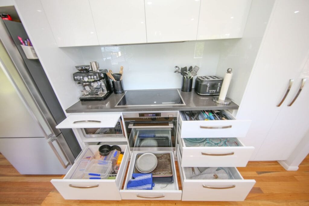 Open Kitchen Storage Drawers Surrounding Stove