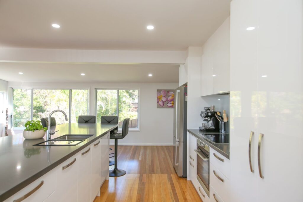 Kitchen Passage Way with Two Door Pantry