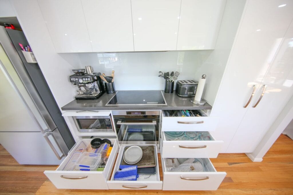 Storage Cupboards for baking pans and containers under kitchen bench