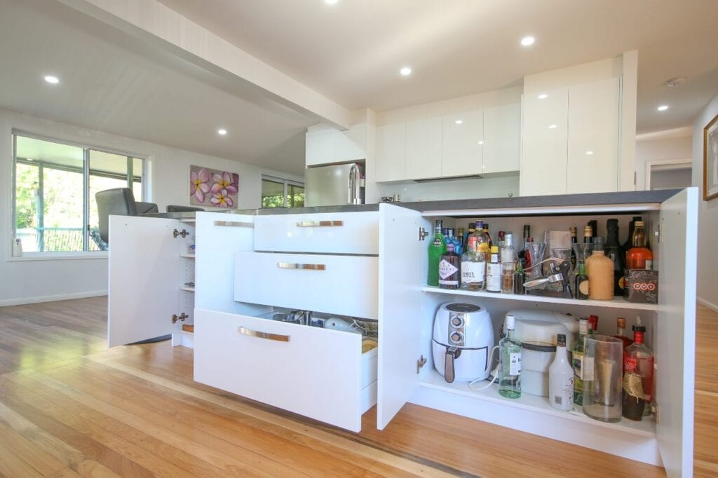 High capacity storage space under kitchen island bench with cupboards and drawers