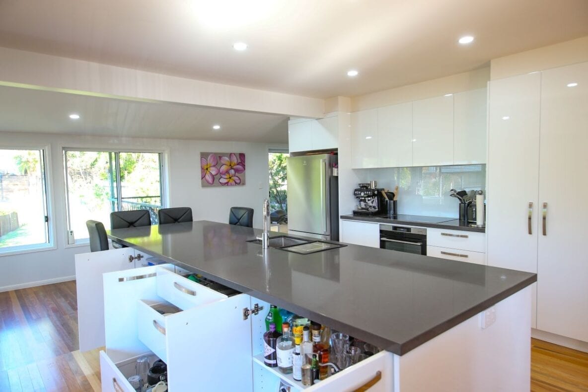 grey stone kitchen countertop in white glossy kitchen