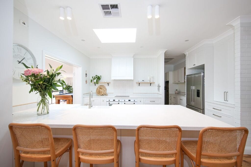 Hamptons Style Kitchen Setting With White Bench and Skylight