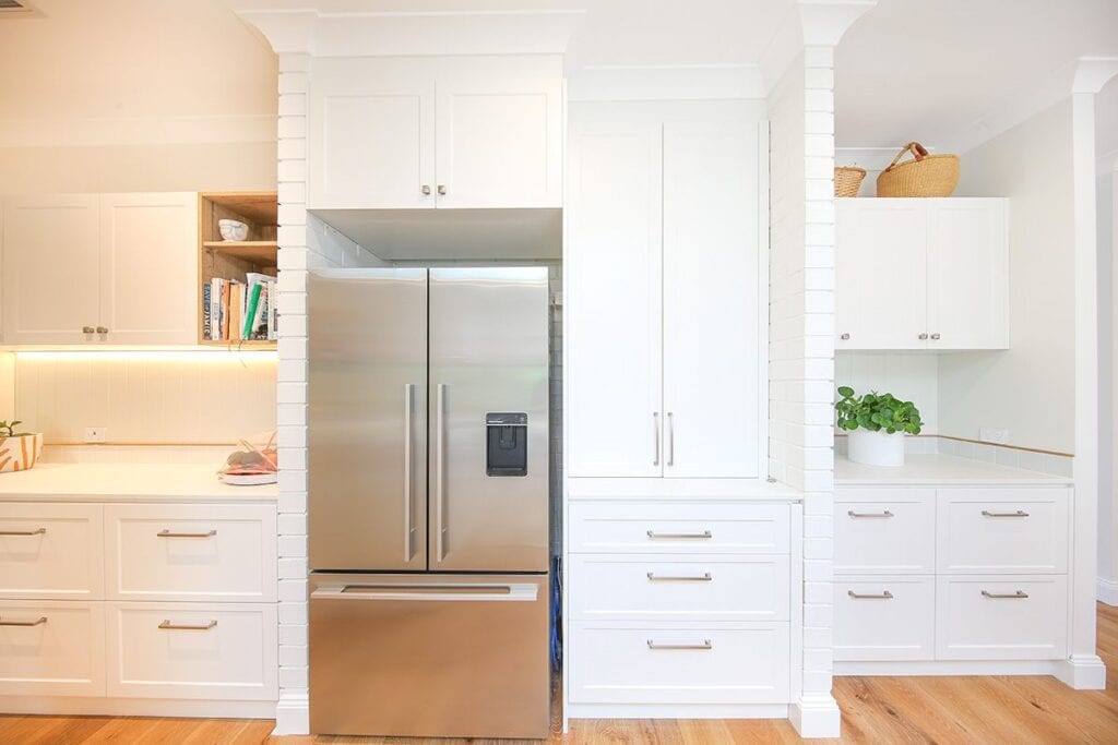 Kitchen Fridge Surrounded by Kitchen Cabinets