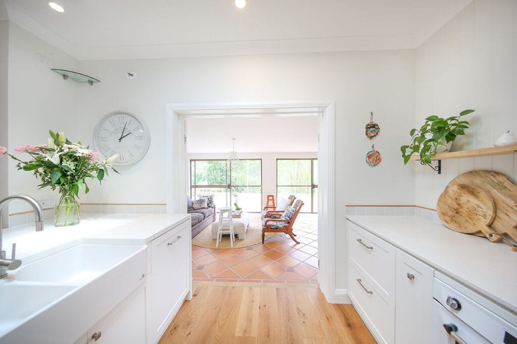 Kitchen Sink and Mixer with View of Living Room