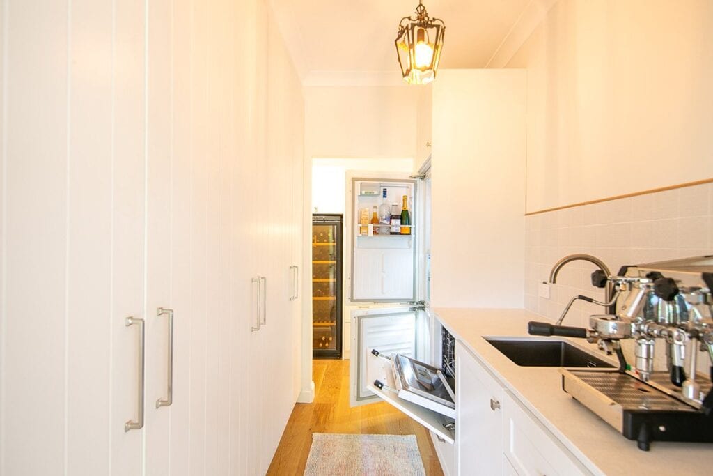 Kitchen With Open Fridge Doors and Dishwasher