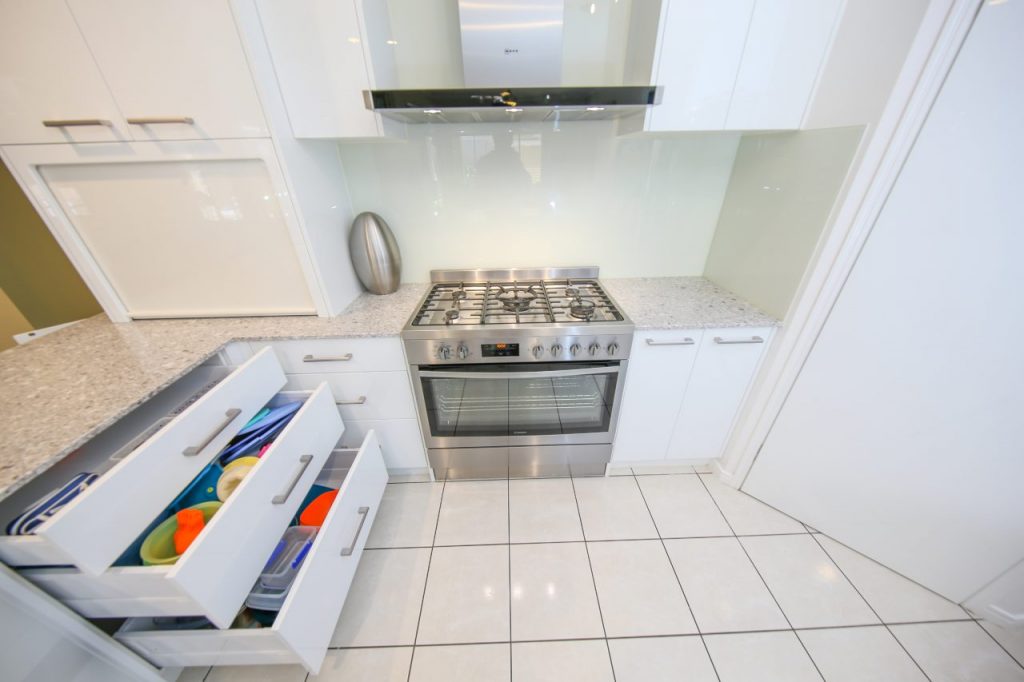 Kitchen Stove and Rangehood With Open Sliding Draws