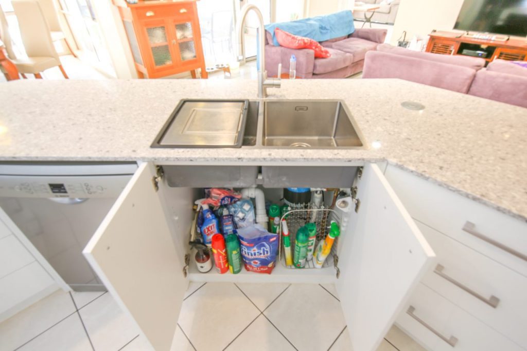 Kitchen Sink With Open Cabinet Doors