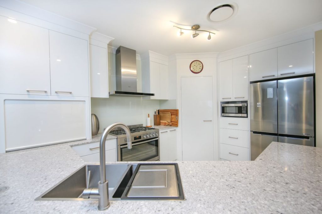 Kitchen Sink, Stove and Stainless Steel Two Door Fridge