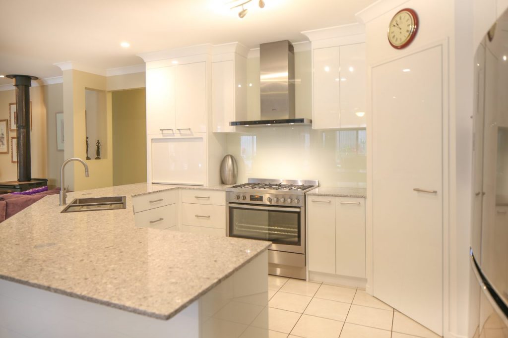 Kitchen Setting With Wood Stove In Background