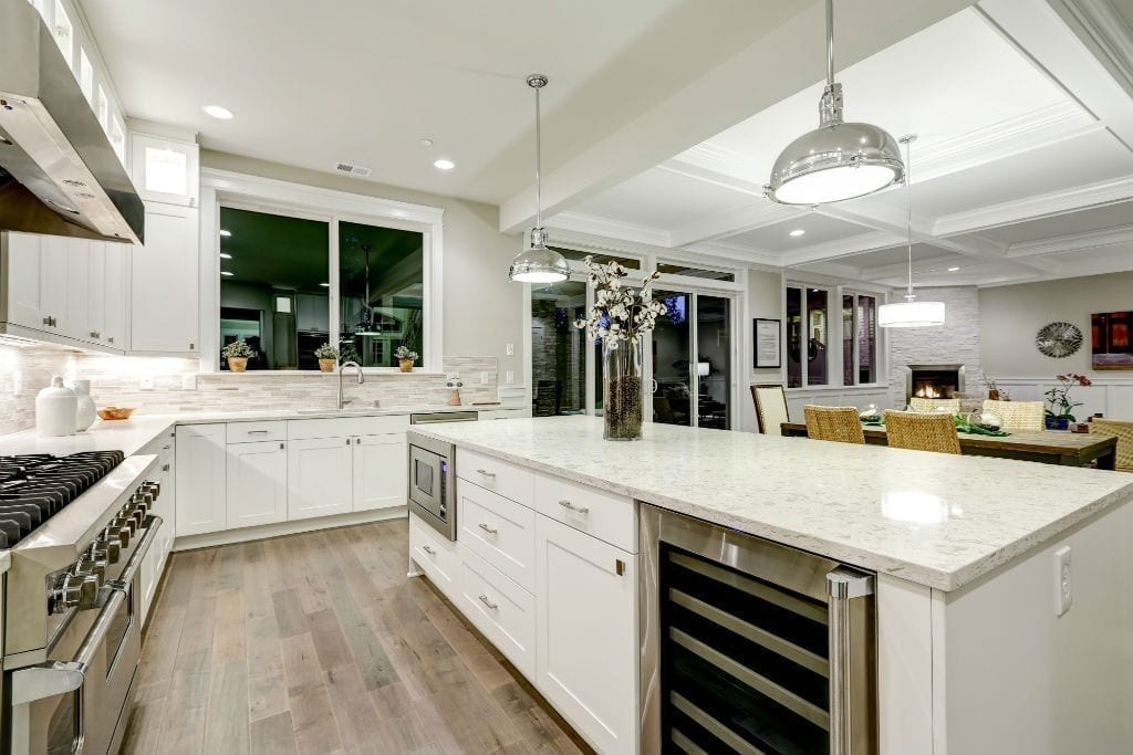 Large kitchen island with overhead light fixtures